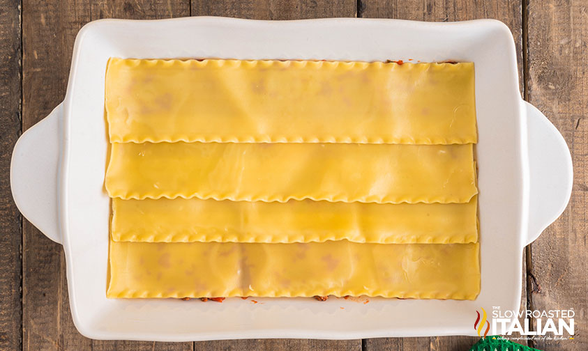 layering lasagna in baking dish