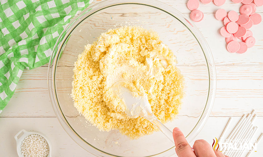 adding icing to crumbled cake