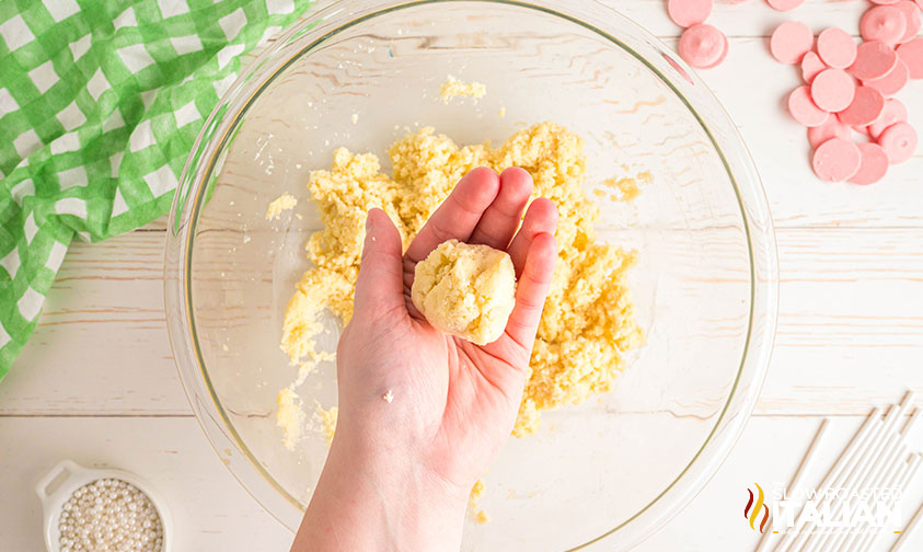 rolling cake mixture into balls for cake pops