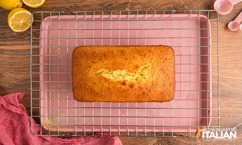 baked lemon loaf on cooling rack