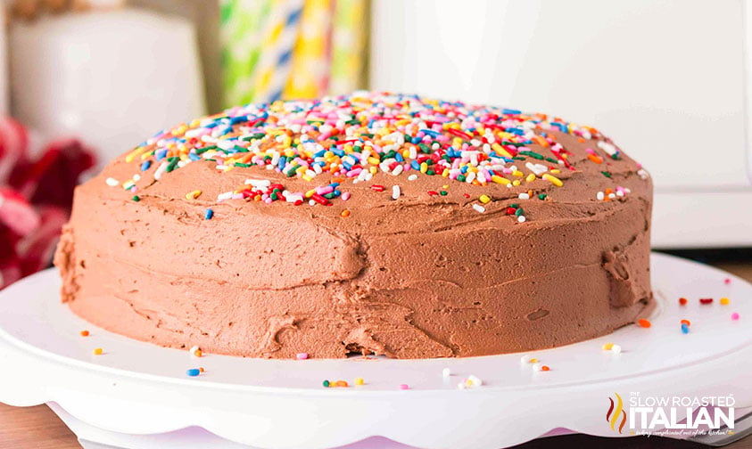 easy air fryer cake covered in chocolate frosting