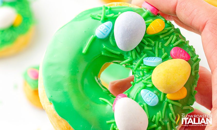 closeup: holding easter themed air fried donut