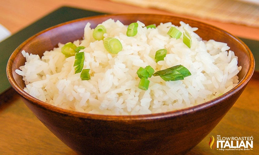 wooden bowl filled with asian sesame rice with scallions