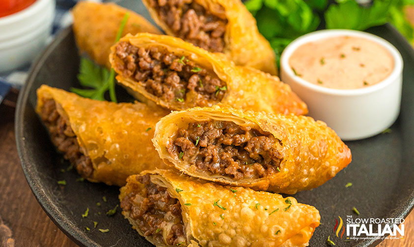 plate of sliced cheeseburger spring rolls