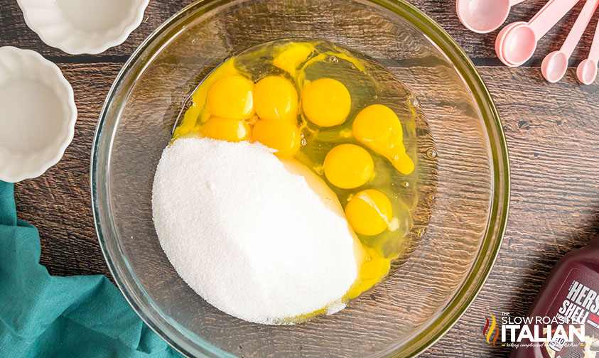 eggs and sugar in a glass mixing bowl