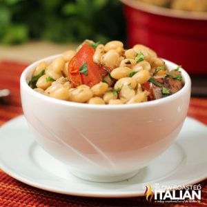 Italian crockpot beans in a small white bowl