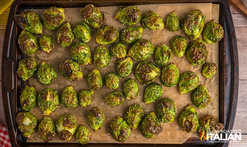 roasted brussel sprouts with balsamic glaze on a sheet pan