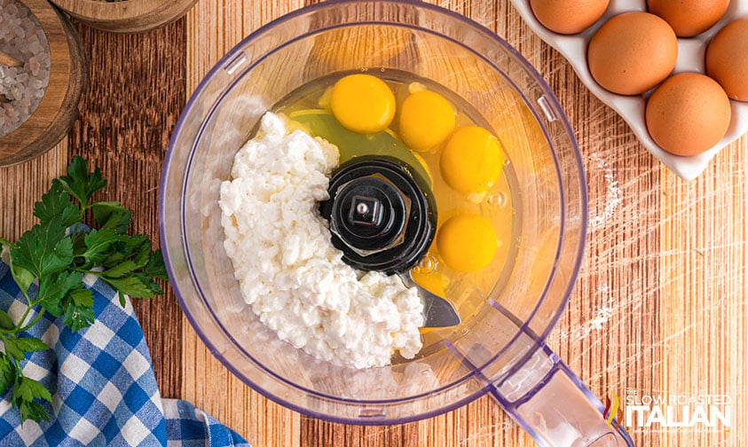 blending eggs and cottage cheese in a food processor
