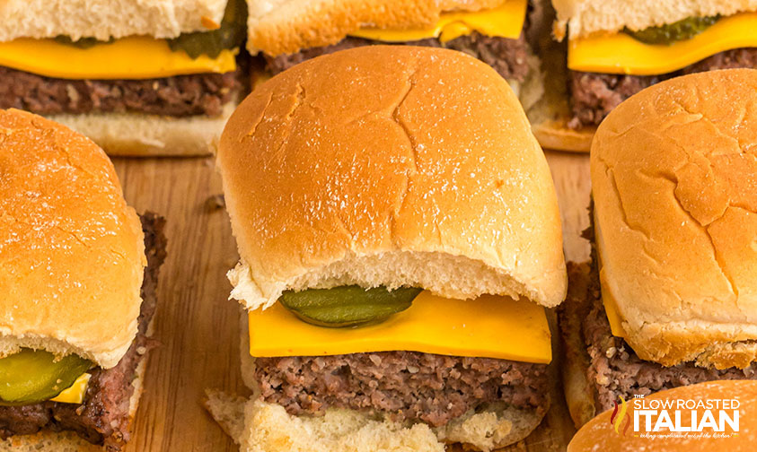 white castle burgers on a wood cutting board