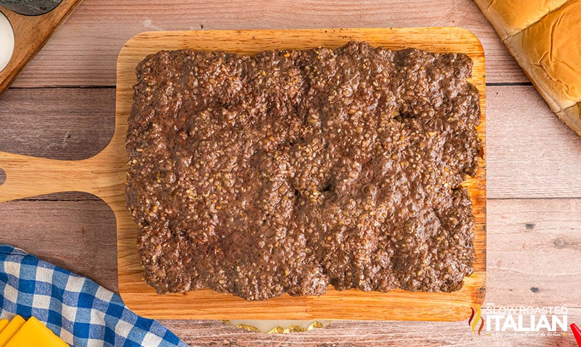 cooked ground beef on a cutting board