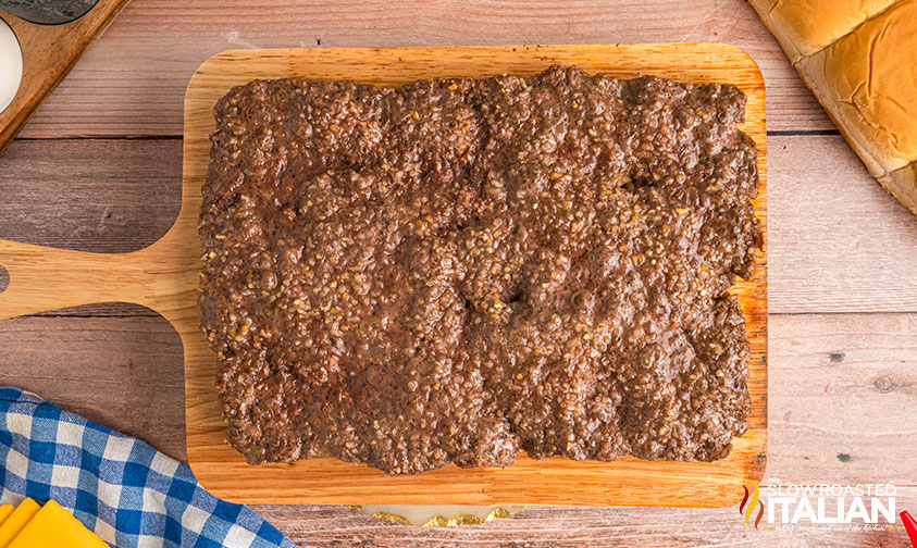 cooked ground beef on a cutting board