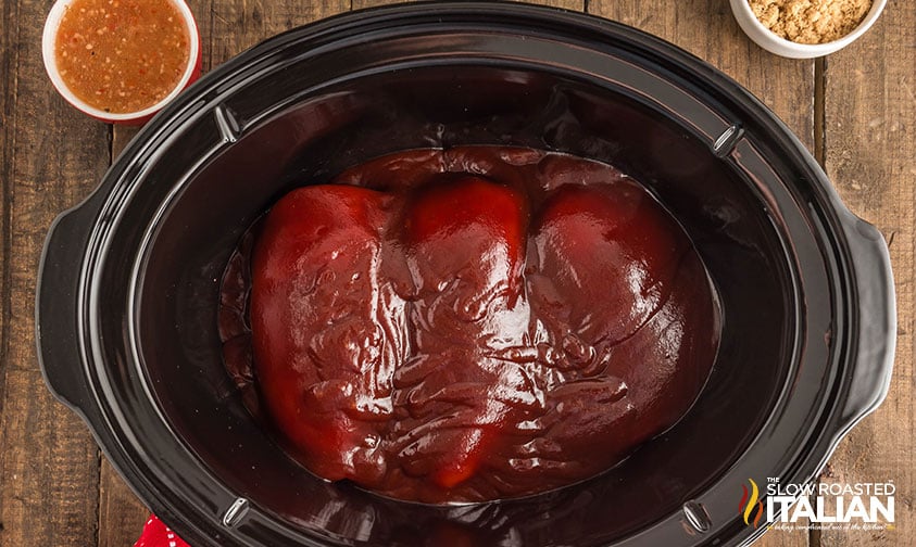 chicken breasts and bbq sauce in crockpot