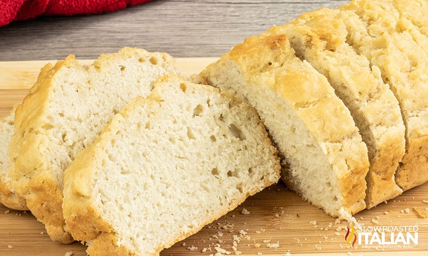 sliced loaf of beer bread on cutting board