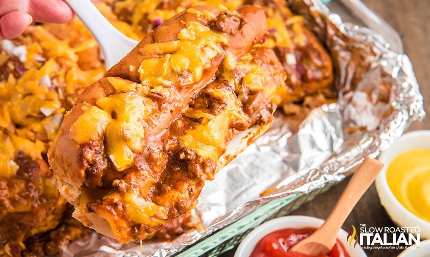 serving baked chili dog from sheet pan