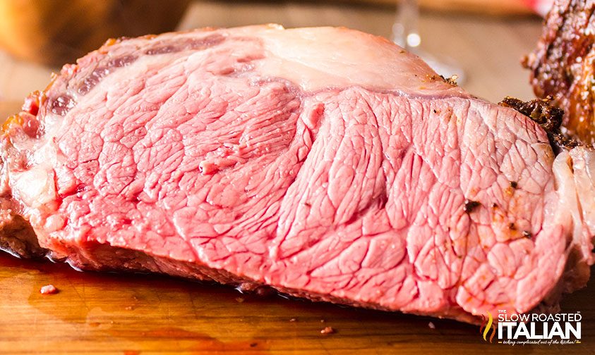 close up: slice of grilled prime rib roast cooked to medium rare