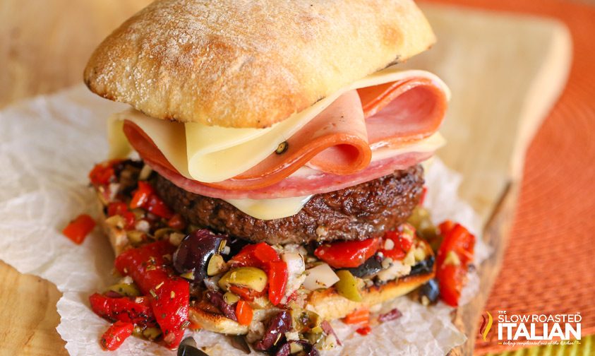 wide shot of a muffaletta burger