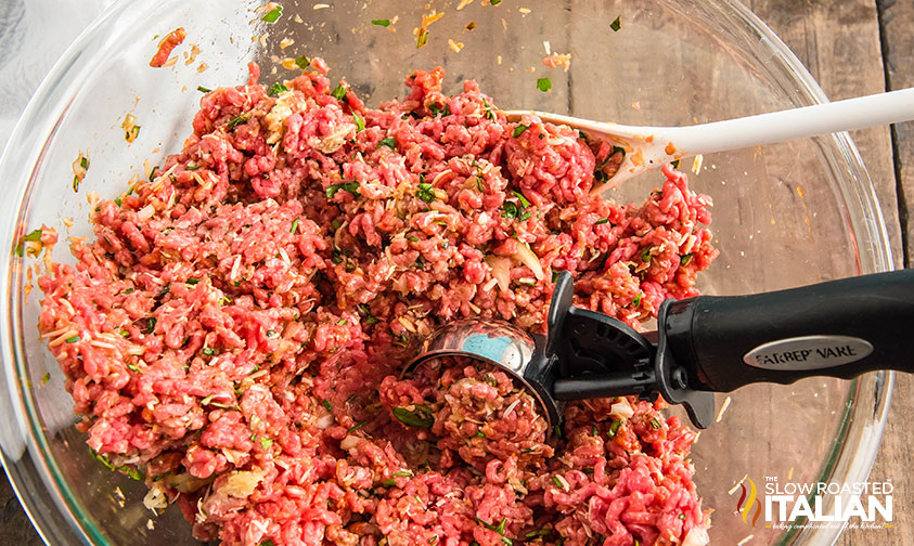 low carb meatball recipe ingredients mixed in a bowl being scooped out