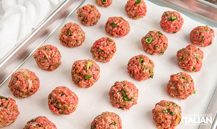 formed low carb meatballs on a parchment lined baking sheet