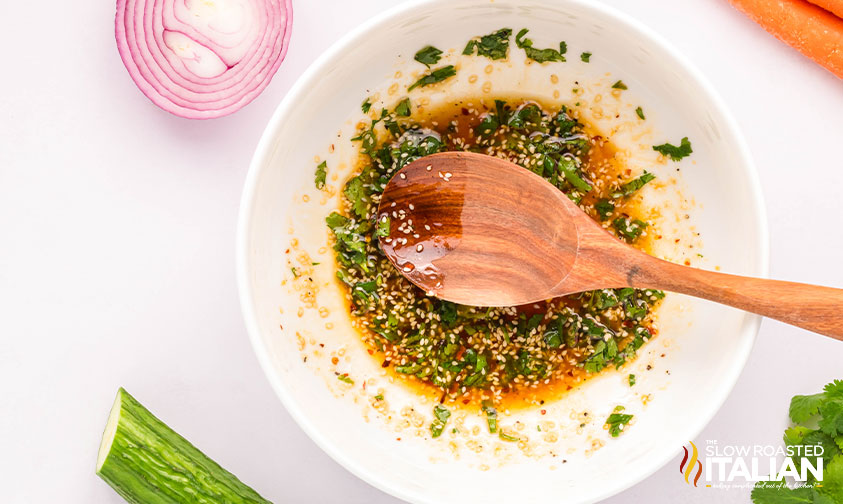 mixing dressing for cucumber and carrot salad