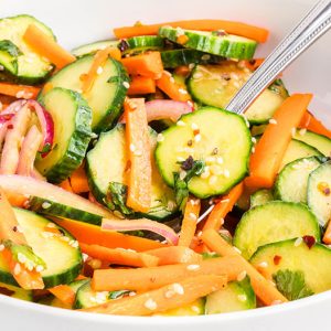 closeup of carrot and cucumber salad in a bowl