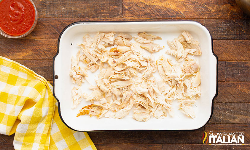 shredded chicken in baking dish