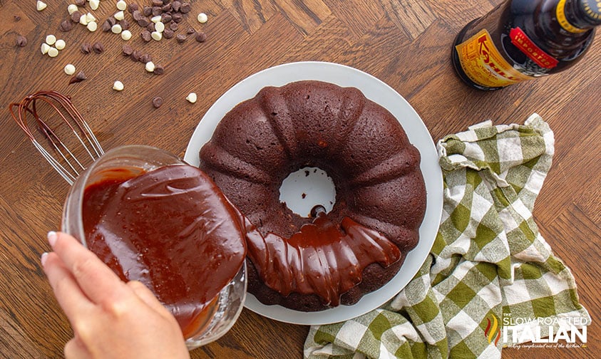 pouring glaze on top of death by chocolate bundt cake