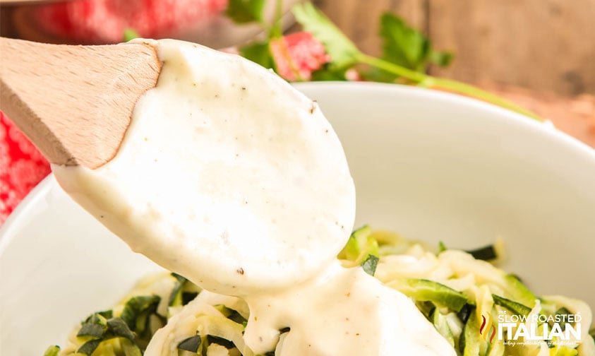 low carb alfredo sauce spooned over zucchini noodles