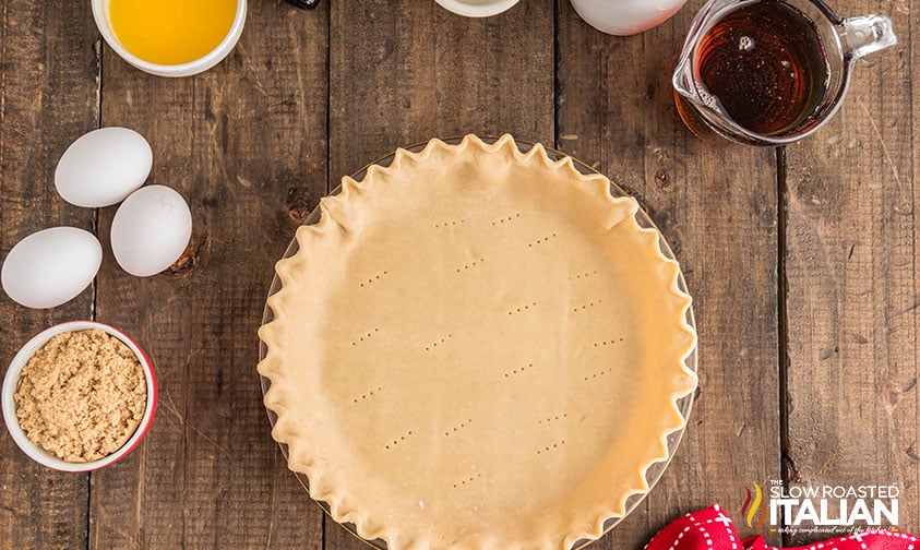 holes poked in a prepared pie crust