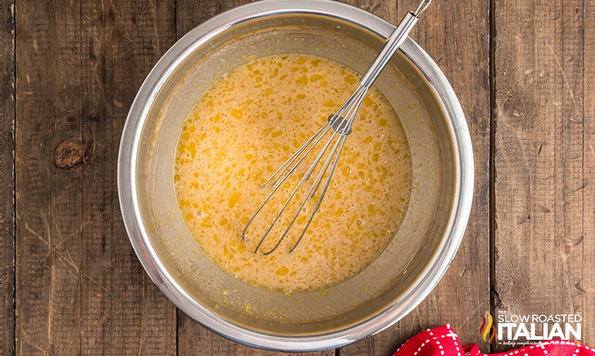 mixing maple pie filling in a stainless steel mixing bowl