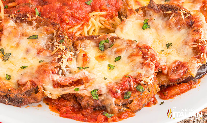 closeup of olive garden eggplant parmesan on a white plate