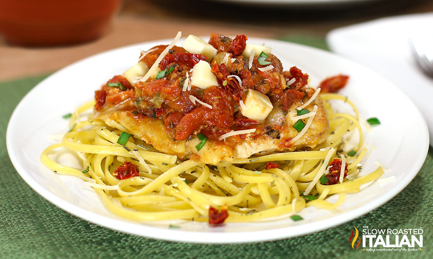 bruschetta chicken pasta on a white plate