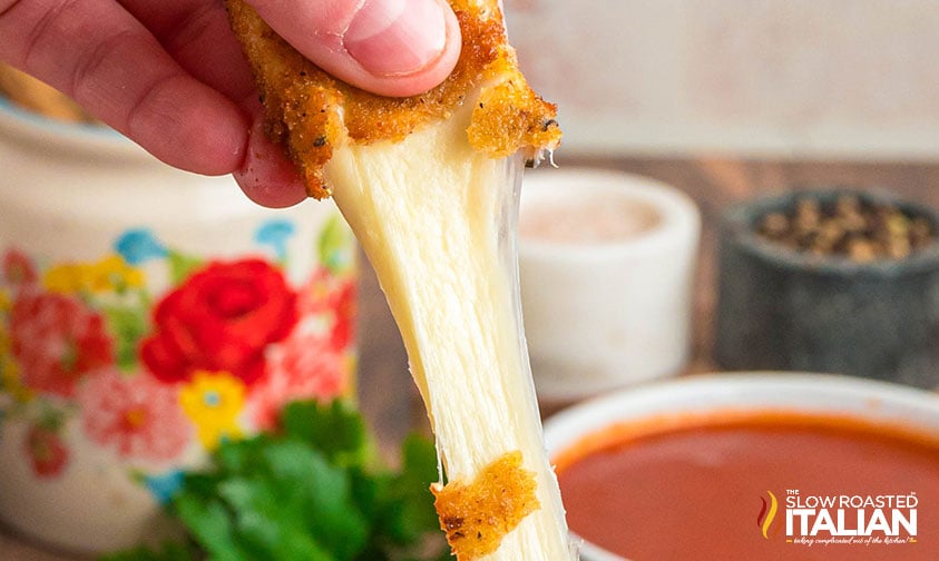 closeup of gooey cheese in tgi friday's mozzarella sticks