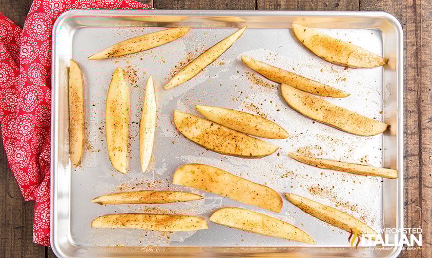 seasoned fresh cut steak fries on baking sheet