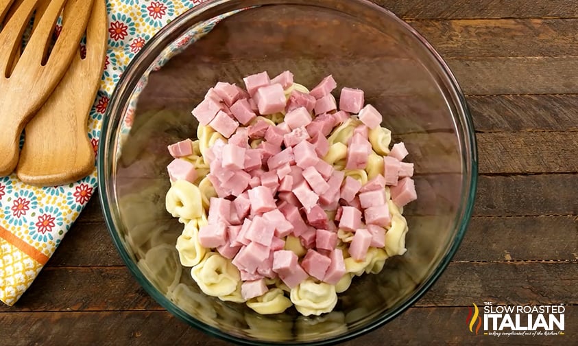 chopped ham added to bowl of tortellini
