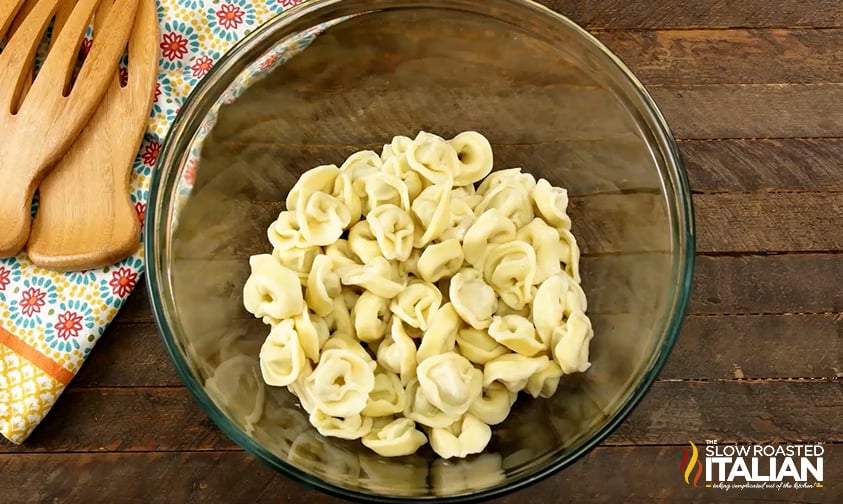 cooked tortellini in large mixing bowl