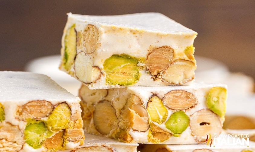 close up: torrone candy squares stacked on top of each other