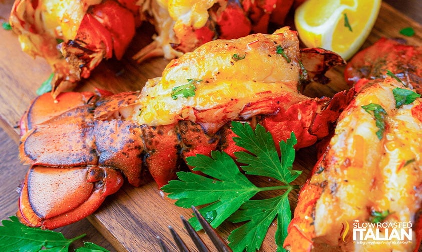 close up: smoked lobster tail with parsley and lemon