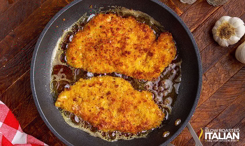 pan fried breaded chicken cutlets in skillet