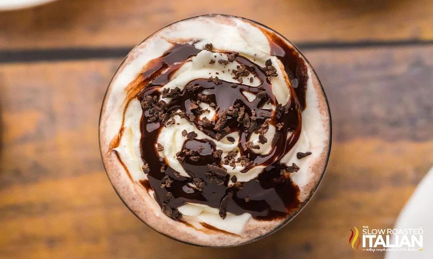overhead: frozen mudslide topped with whipped cream, chocolate drizzle, and shaved chocolate