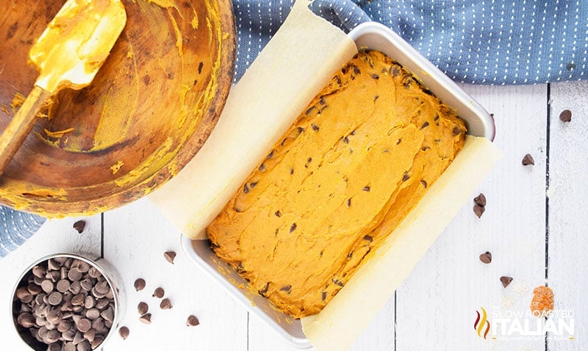 batter for pumpkin chocolate chip loaf smoothed into baking pan