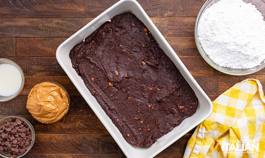 butterfinger brownie batter smoothed into a baking pan