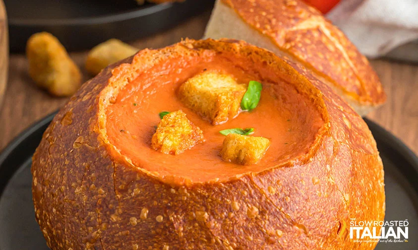 bread bowl of panera tomato soup topped with croutons