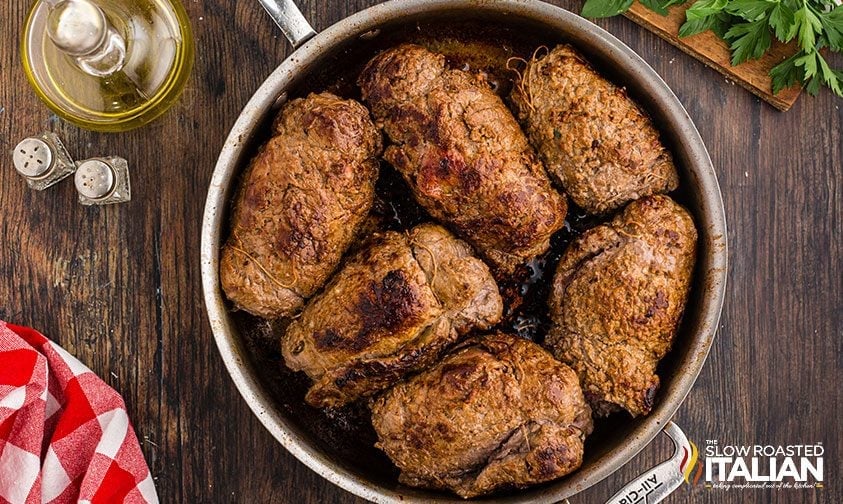 browned Italian braciola in a skillet
