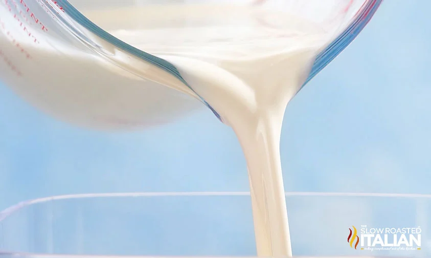 pouring liquid creamer into blender