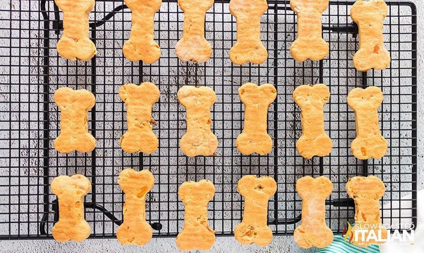 bone-shaped homemade dog treats cooling on wire rack