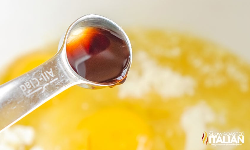 adding vanilla extract to bowl for cake mix cookie dough