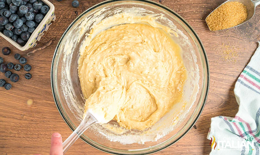 mixing batter in a bowl for homemade starbucks muffins
