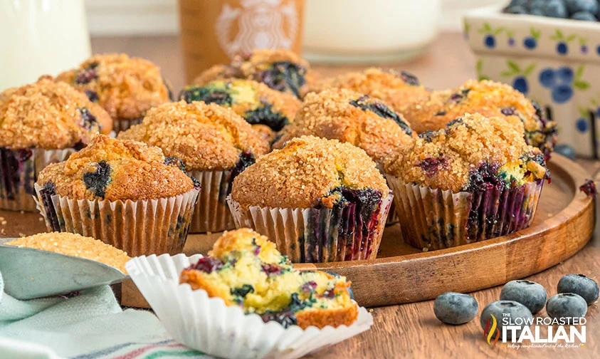 tray of freshly baked blueberry muffins like Starbucks, with one partially eaten