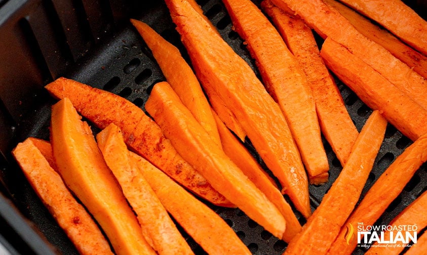 seasoned sweet potatoes fries in air fryer basket