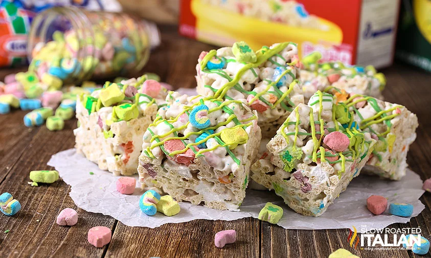 lucky charms bars with green drizzle on piece of parchment
